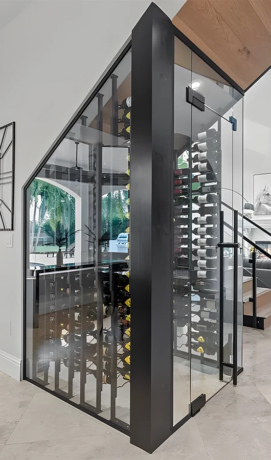 High-quality glass wine cellar enclosure with sleek black frame.