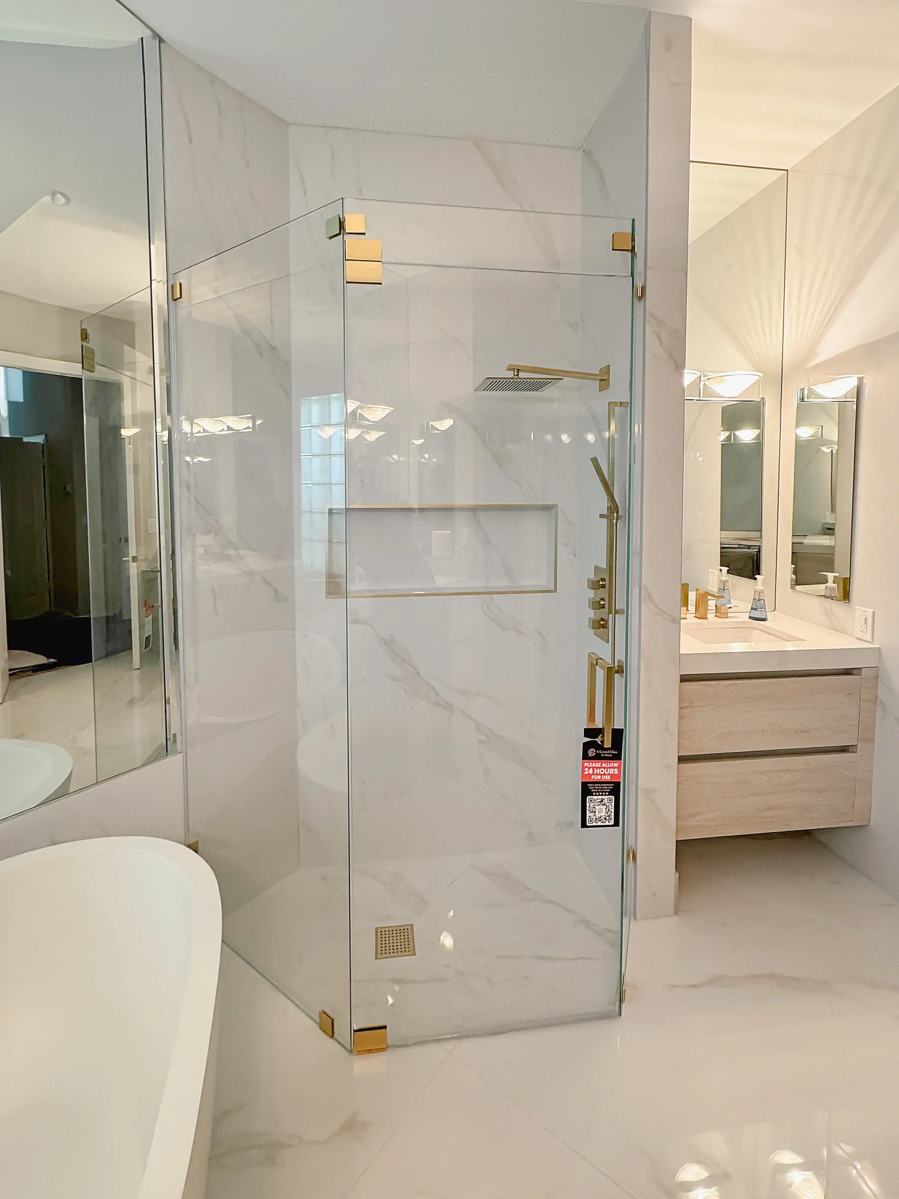 High-quality glass shower enclosure with elegant gold hardware. Perfect for modern bathroom upgrades.