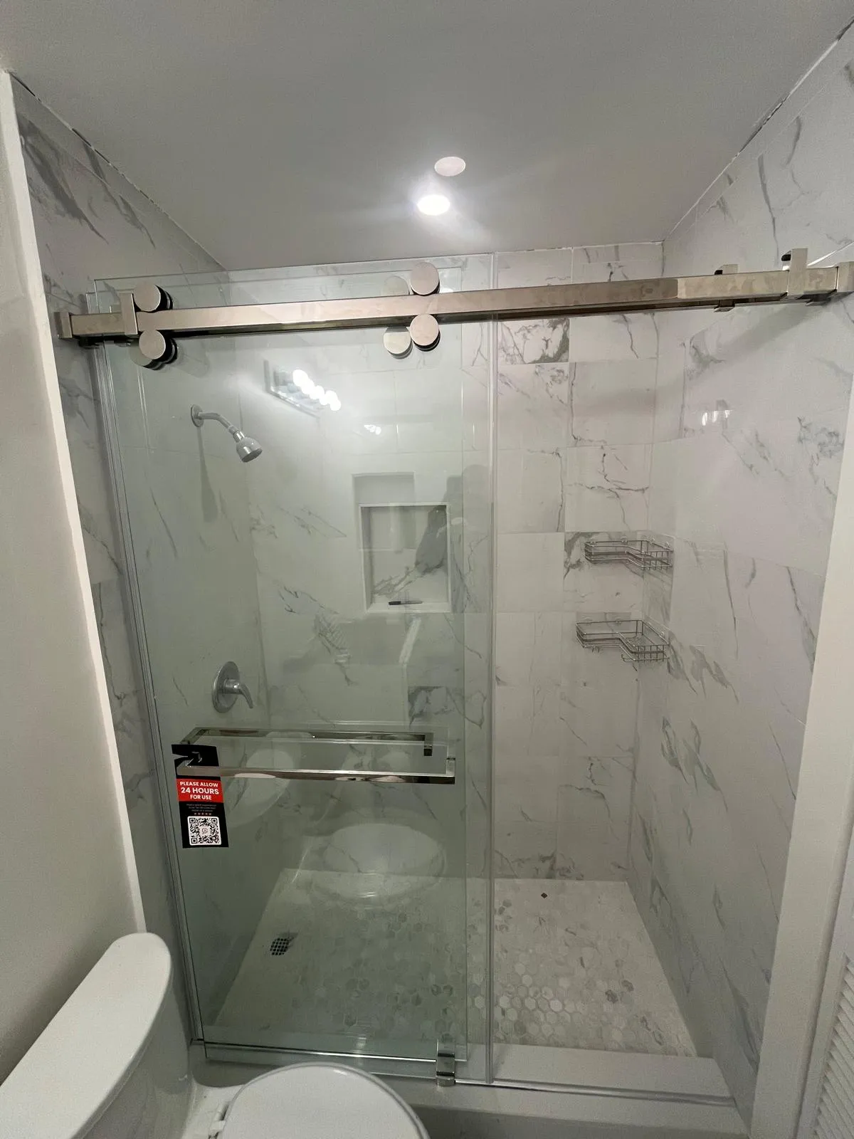 High-quality glass shower enclosure with stainless steel sliding door hardware. Perfect for modern bathroom upgrades.