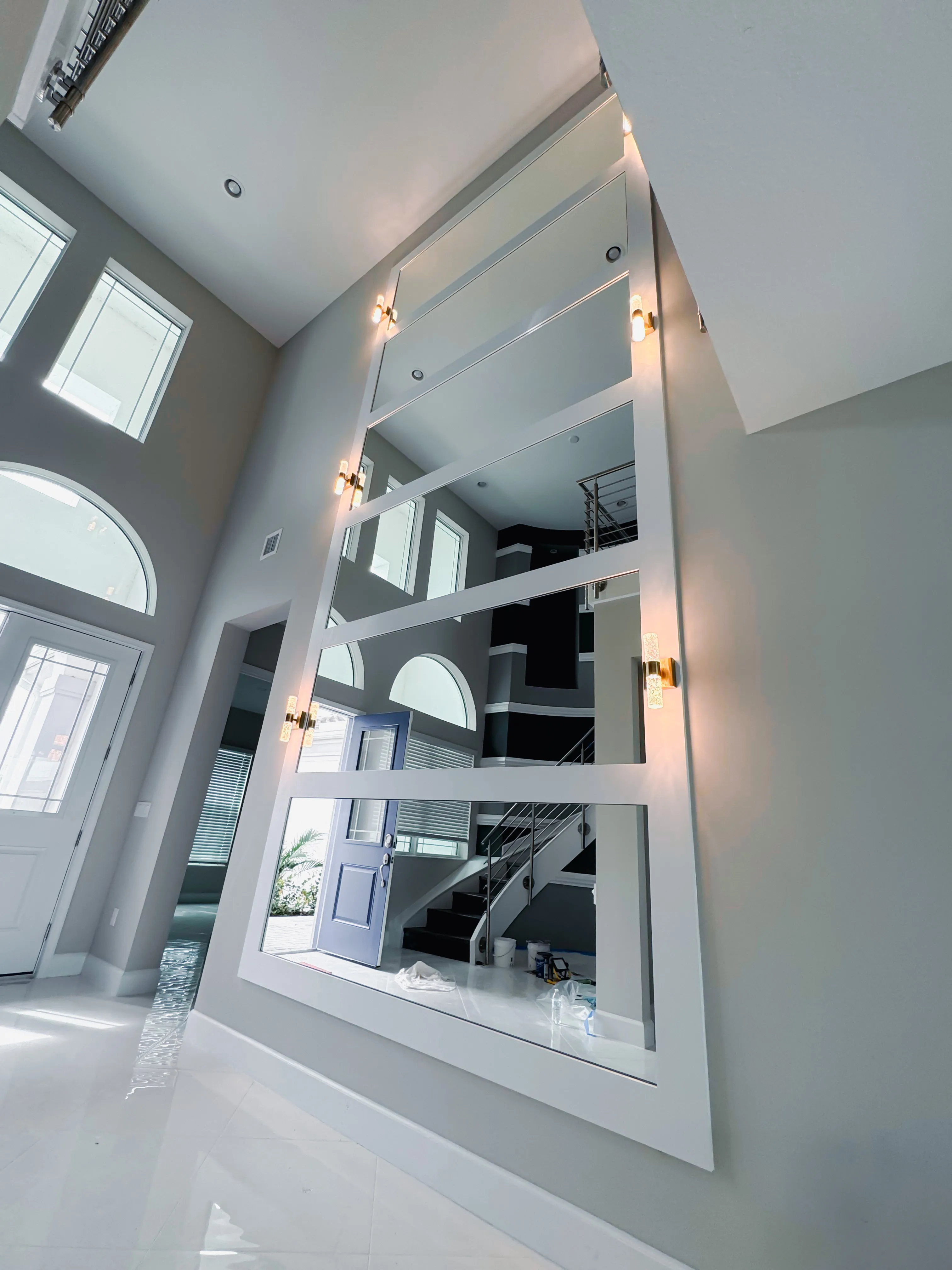 Modern decorative wall mirror with built-in LED lighting.