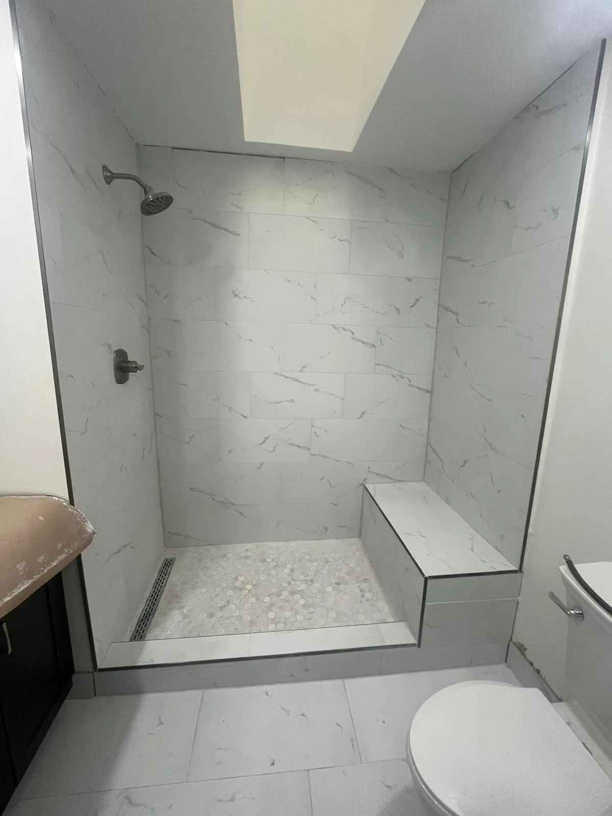 High-quality glass shower enclosure with elegant marble finish for modern bathrooms.