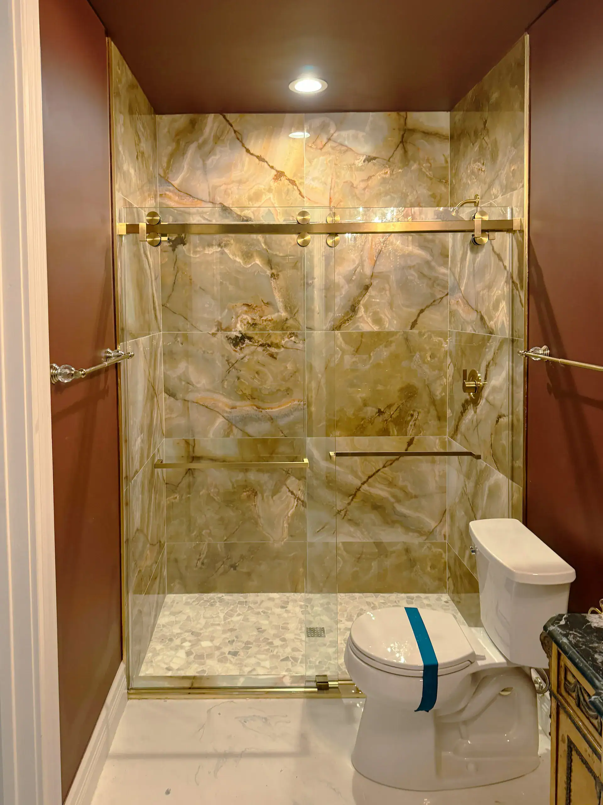 Properly installed glass and mirror for luxurious bathroom design.