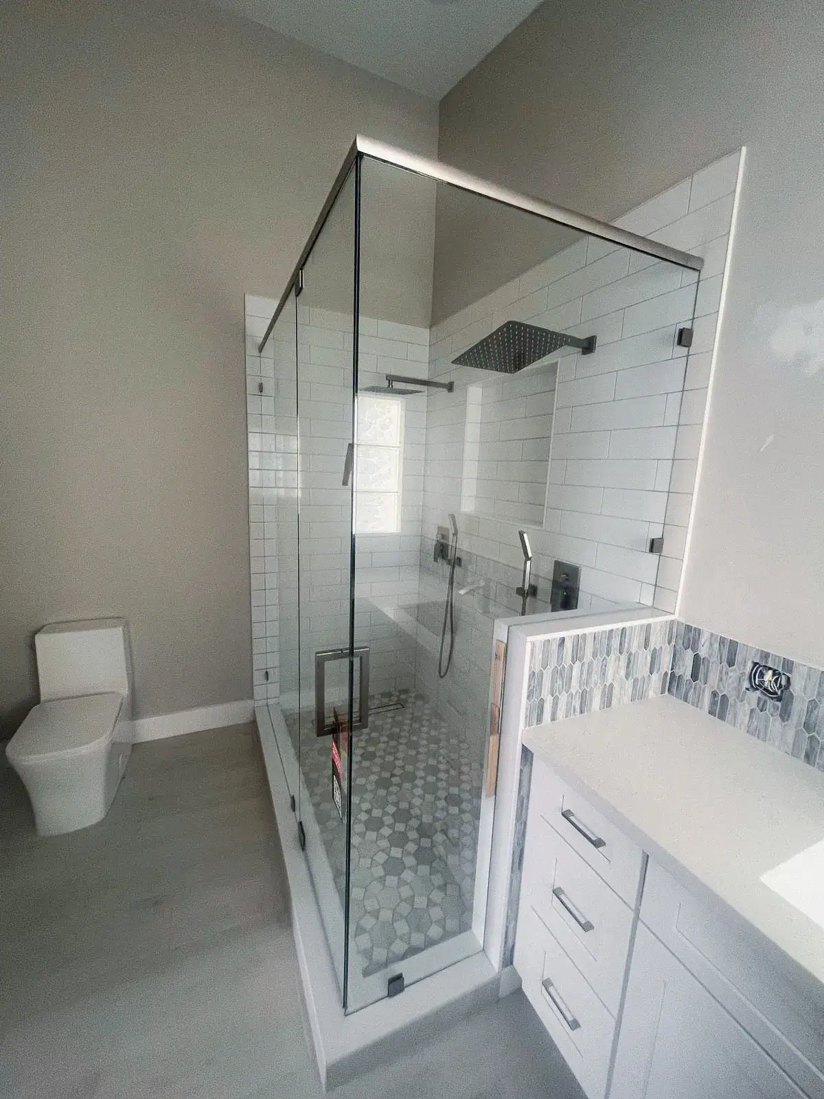 High-quality glass shower door with modern design and sleek metal frame. Perfect for luxury bathroom upgrades.