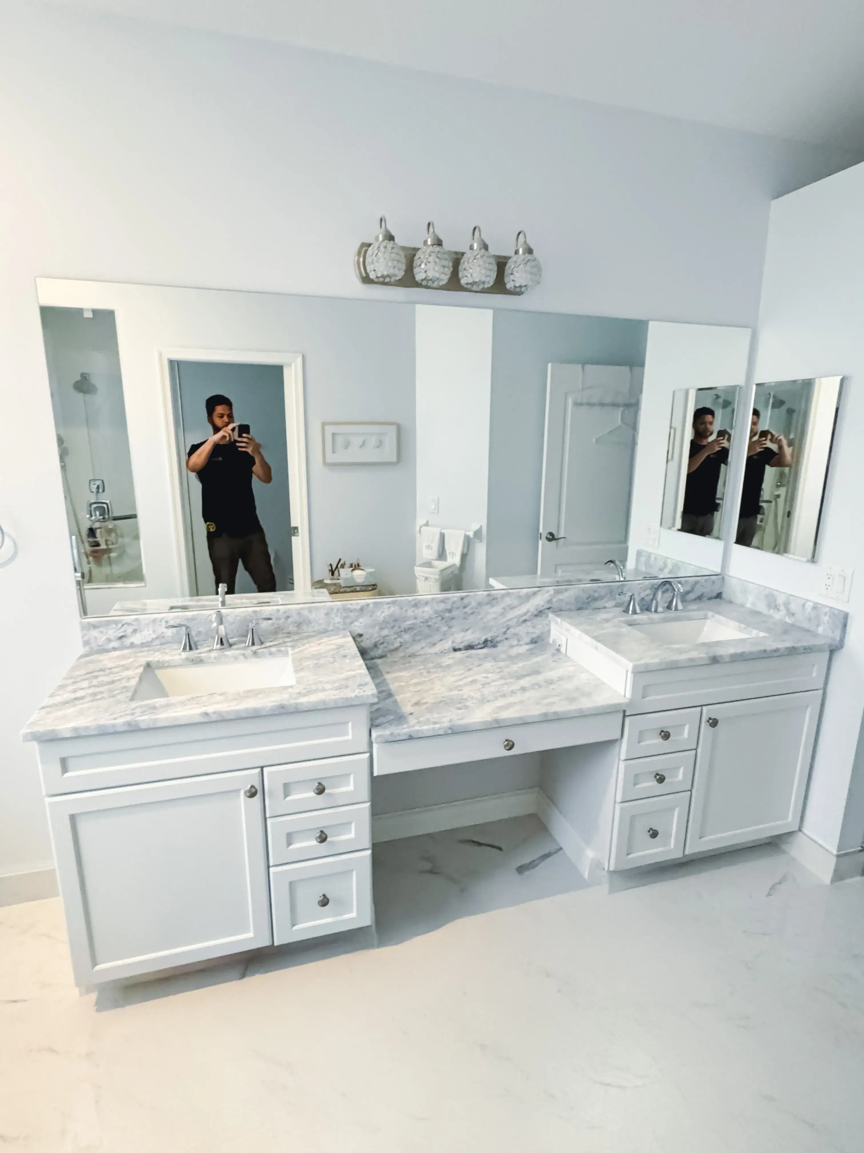 High-quality glass mirror and custom vanity for luxurious bathroom design.