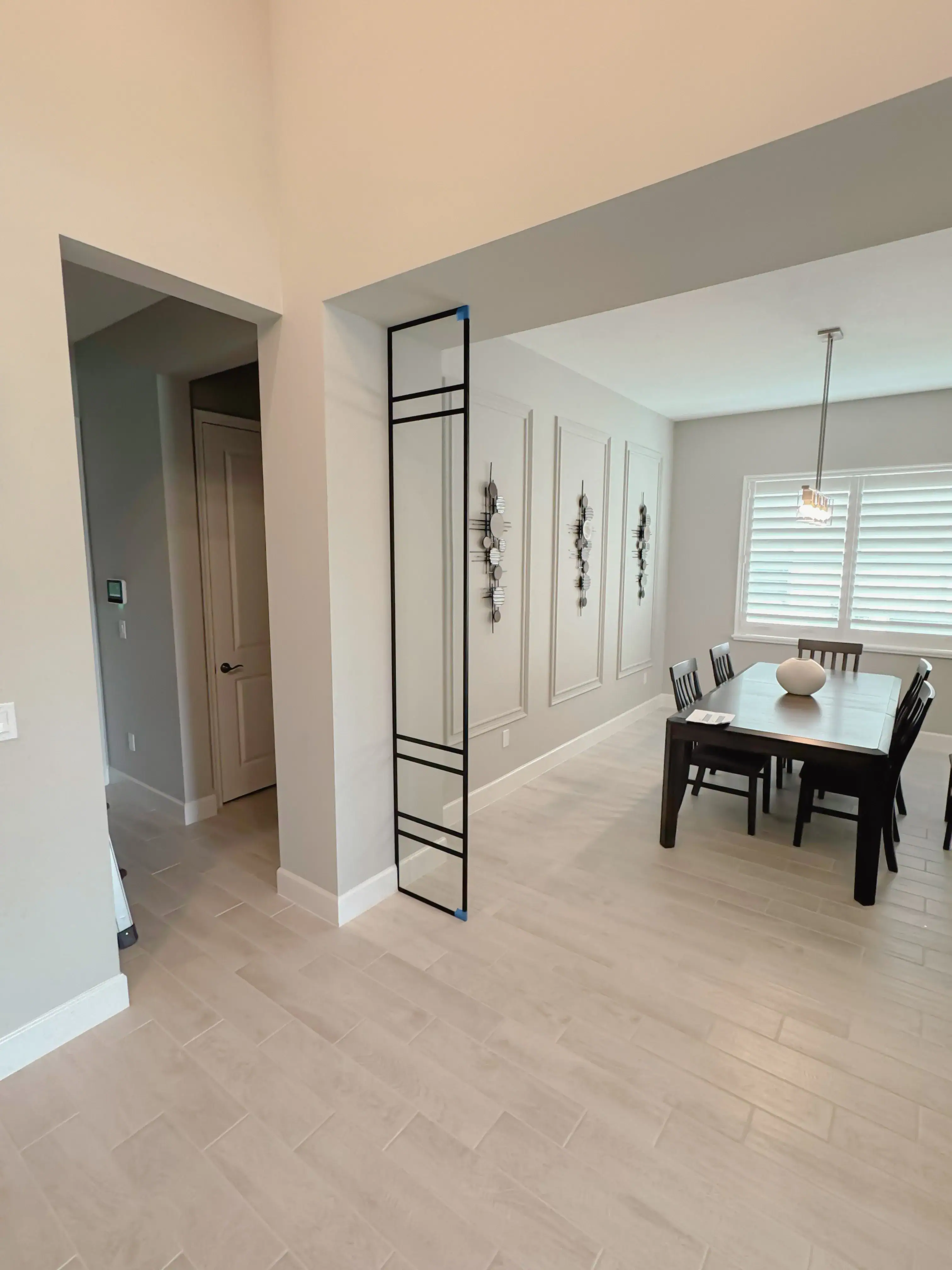 High-quality glass and metal room divider for stylish home decor.