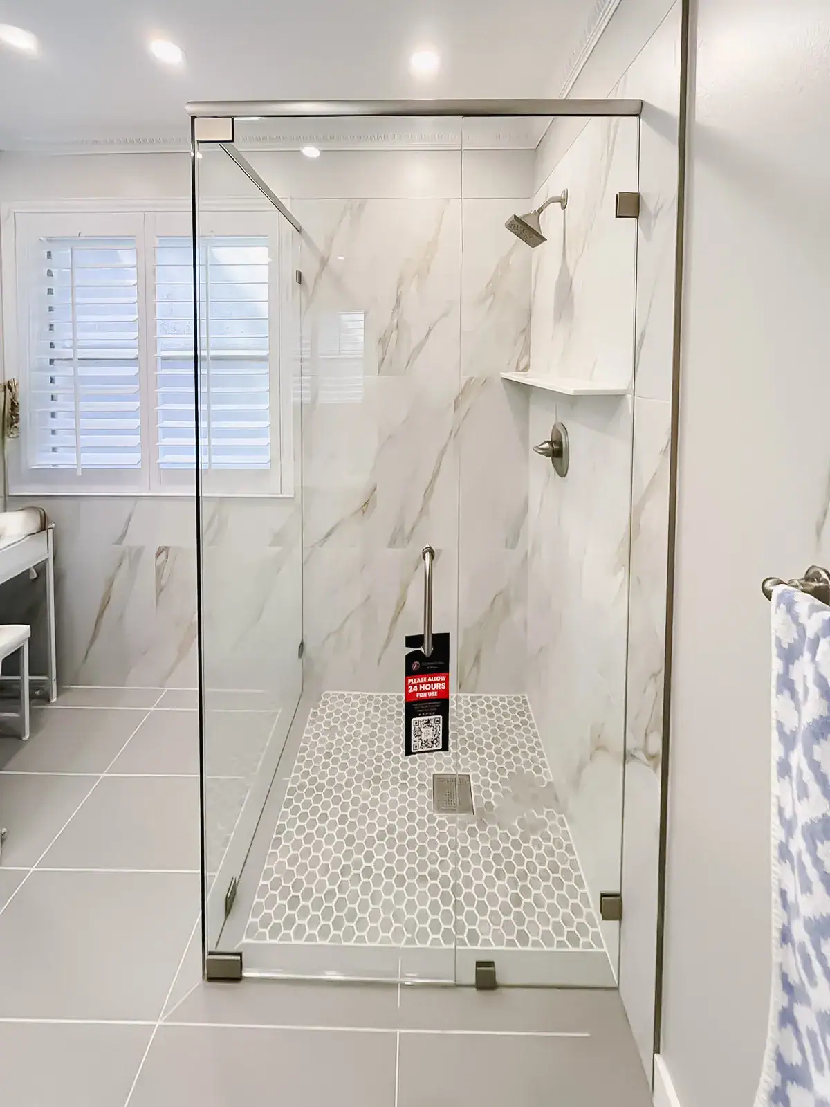 Clear glass shower door with sleek hardware for a stylish bathroom upgrade.