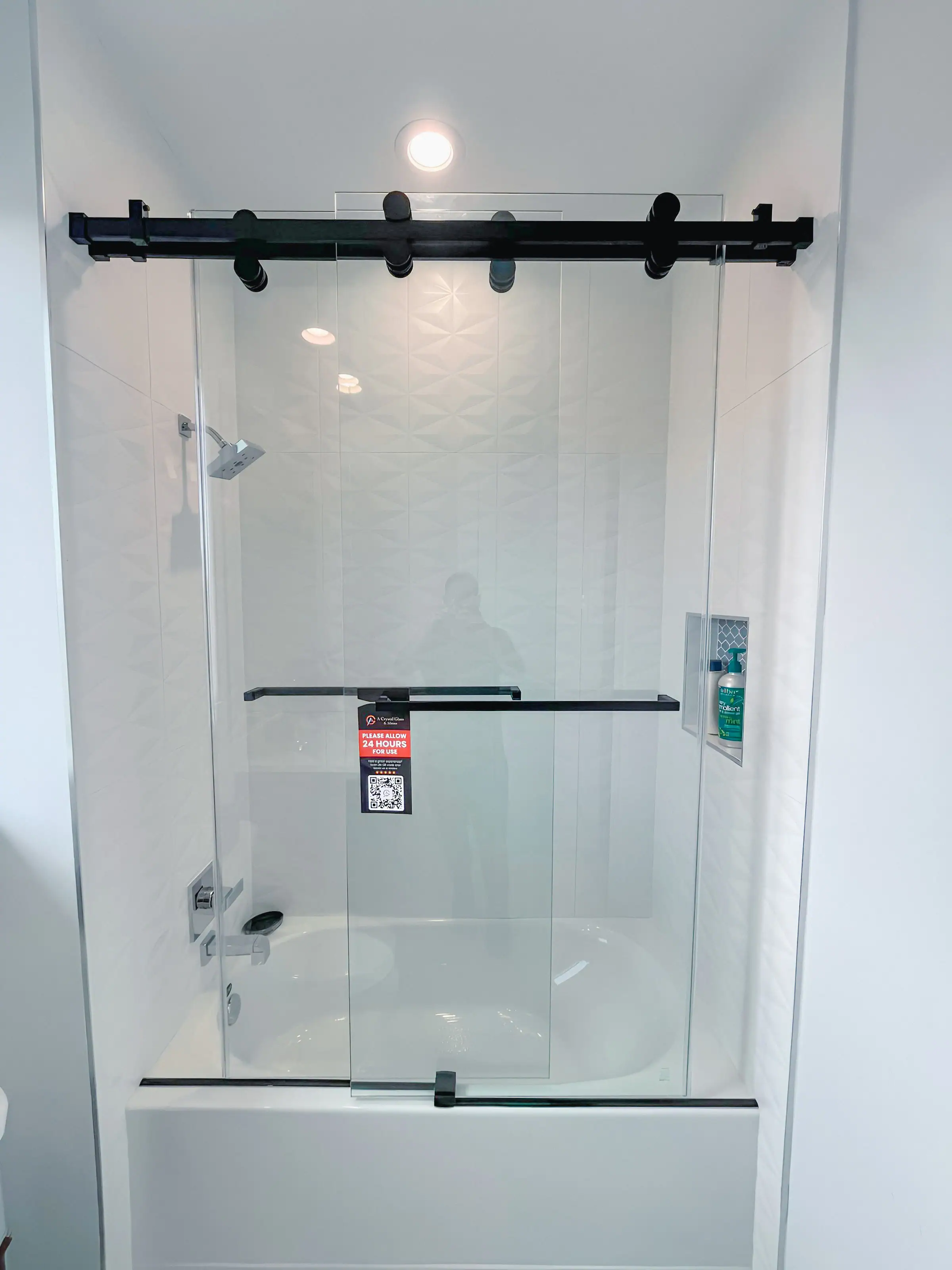 Premium custom glass shower door with sleek hardware for modern bathrooms.