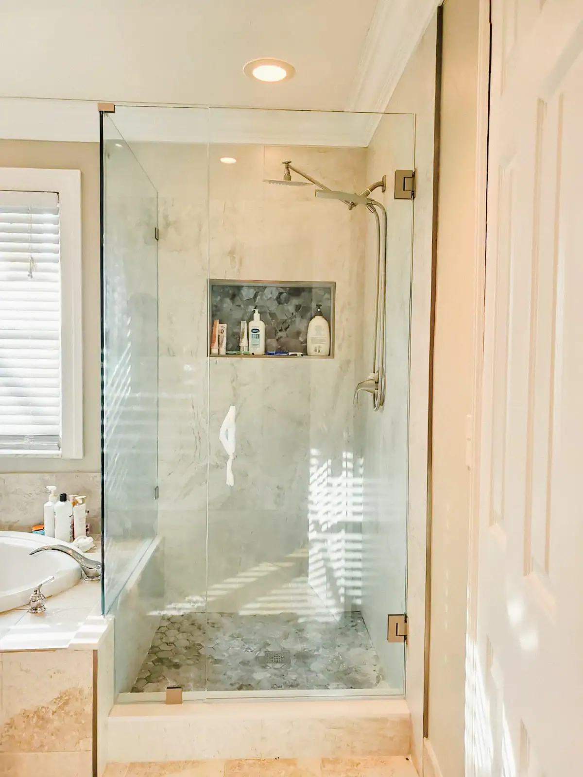 High-quality glass shower door with modern frameless style and sleek hardware. Perfect for luxurious bathrooms.