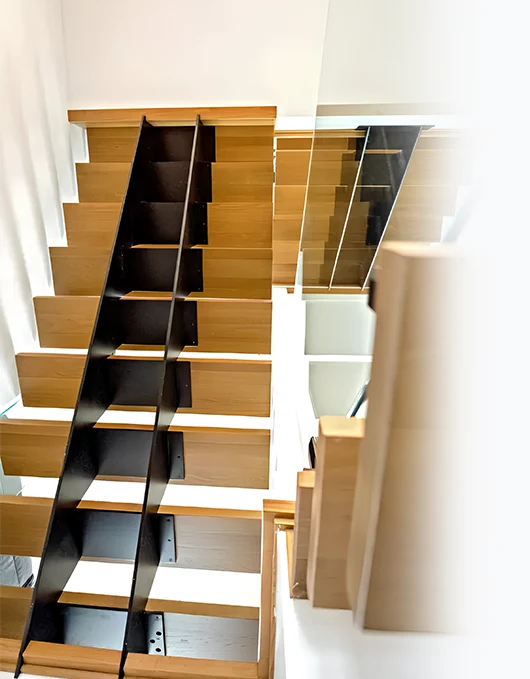 The Oslo floating stairs redefine structural integrity with twin steel cores—perfect harmony of form and function.