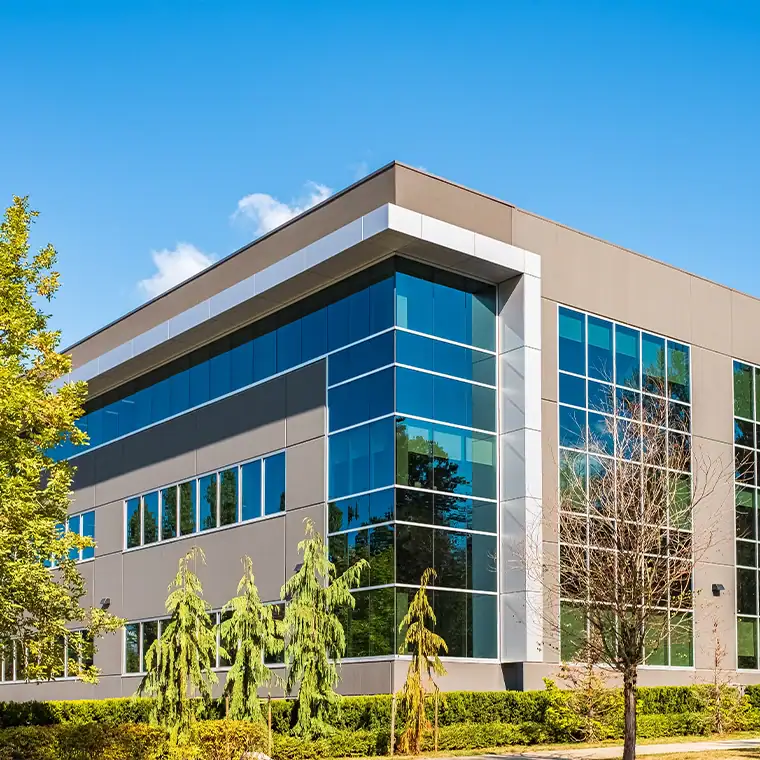Elegant commercial glass installation with reflective mirrors and aluminum framing.