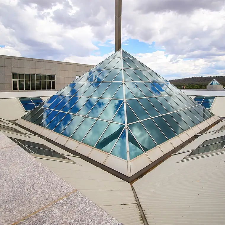 Glass pyramid skylight for modern building design.