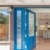 High-quality glass doors with decorative glass and vibrant blue color. Custom glass solutions for modern home entrances.