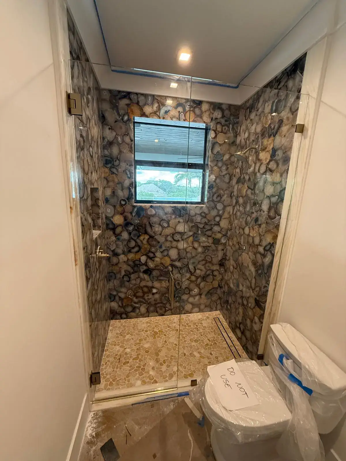 Clear glass shower enclosure with modern design.