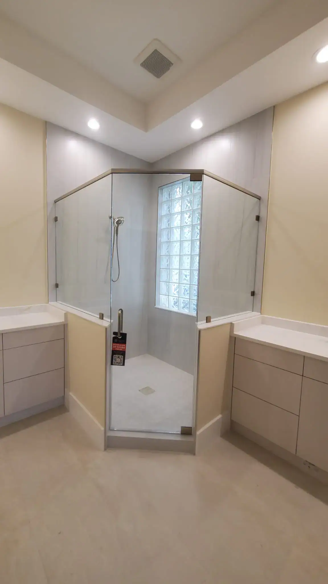 Clean glass shower door with frameless design and modern fixtures.