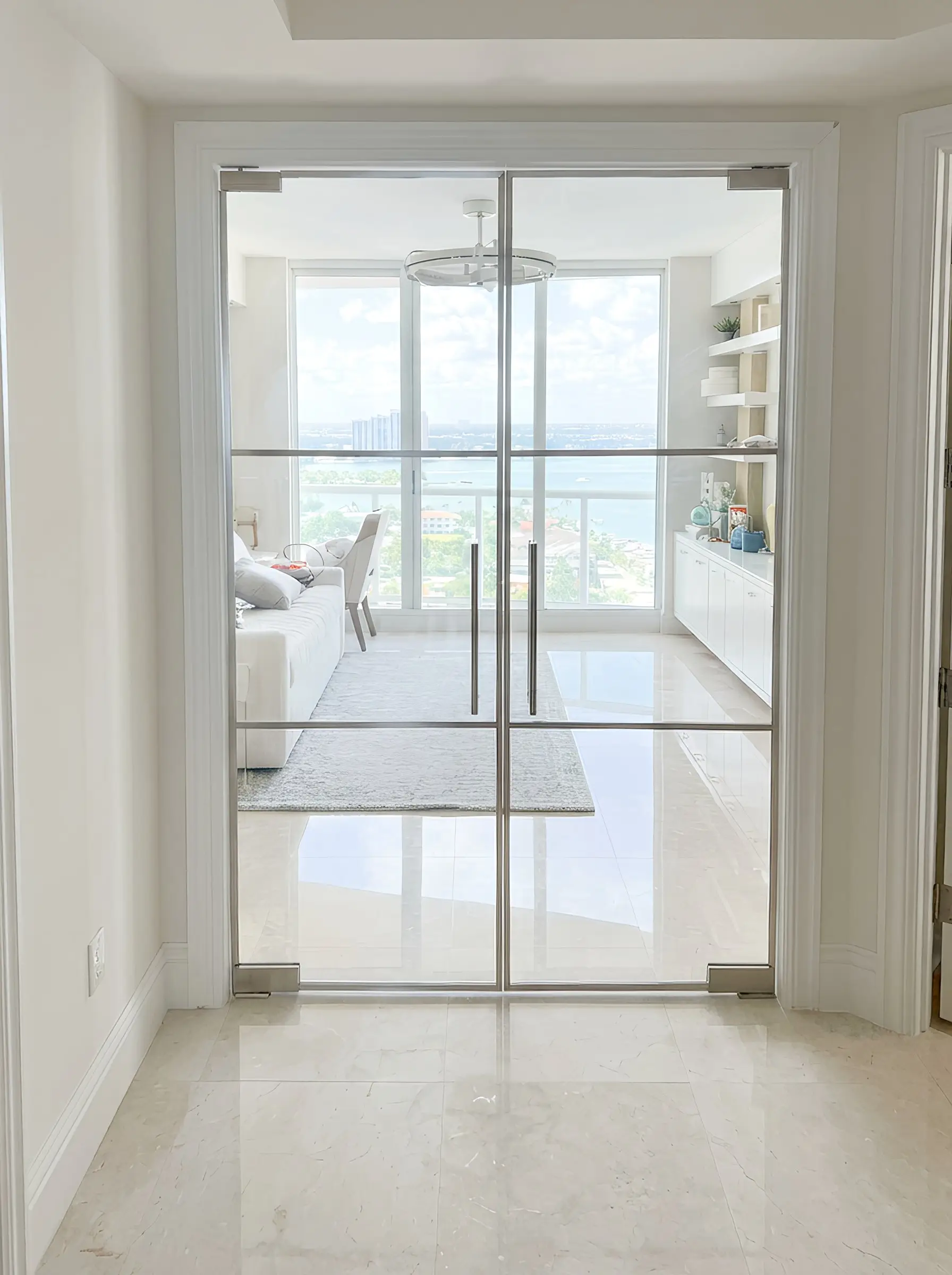 Smooth glass sliding door with mirror for stylish interior design.