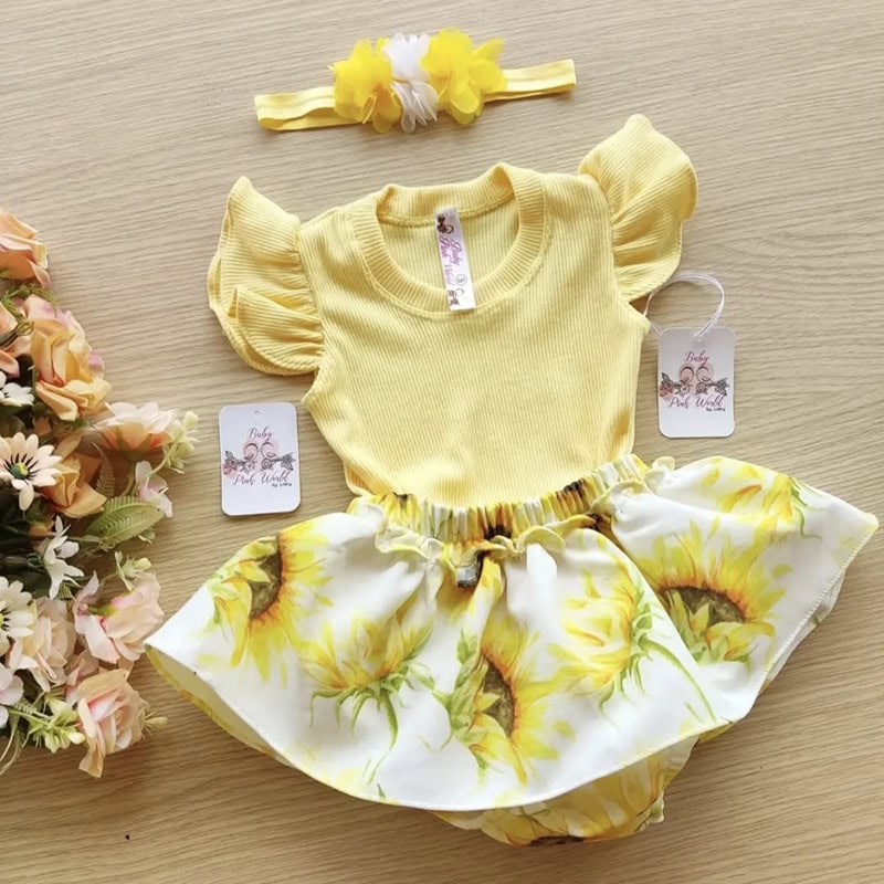 2. Conjunto de bebé rosa y amarillo con top de volantes y falda con girasoles, perfecto para ocasiones especiales.