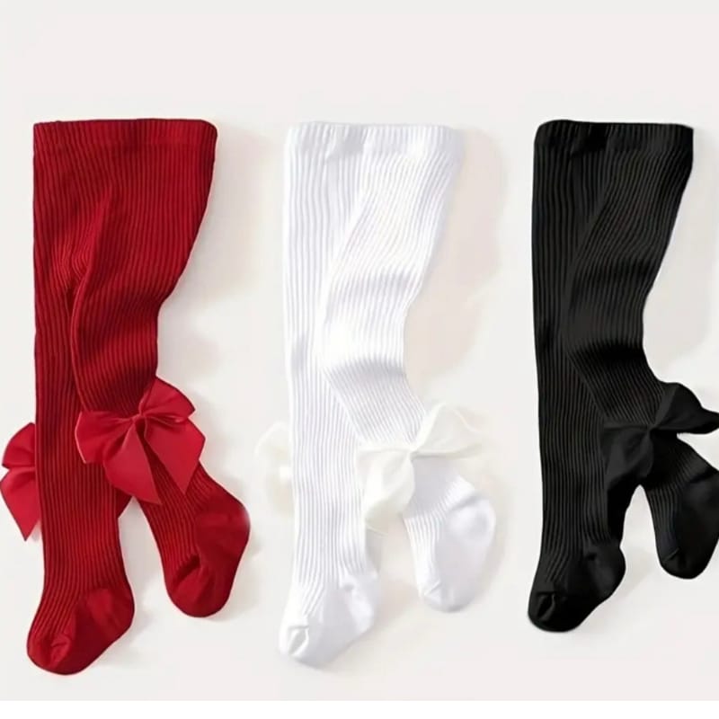 Medias infantiles con lazo rosa y rayas, perfectas para ocasiones especiales.